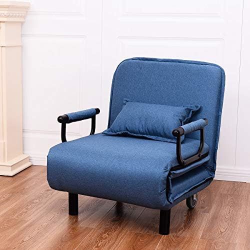 a blue chair sitting on top of a hard wood floor next to a white wall