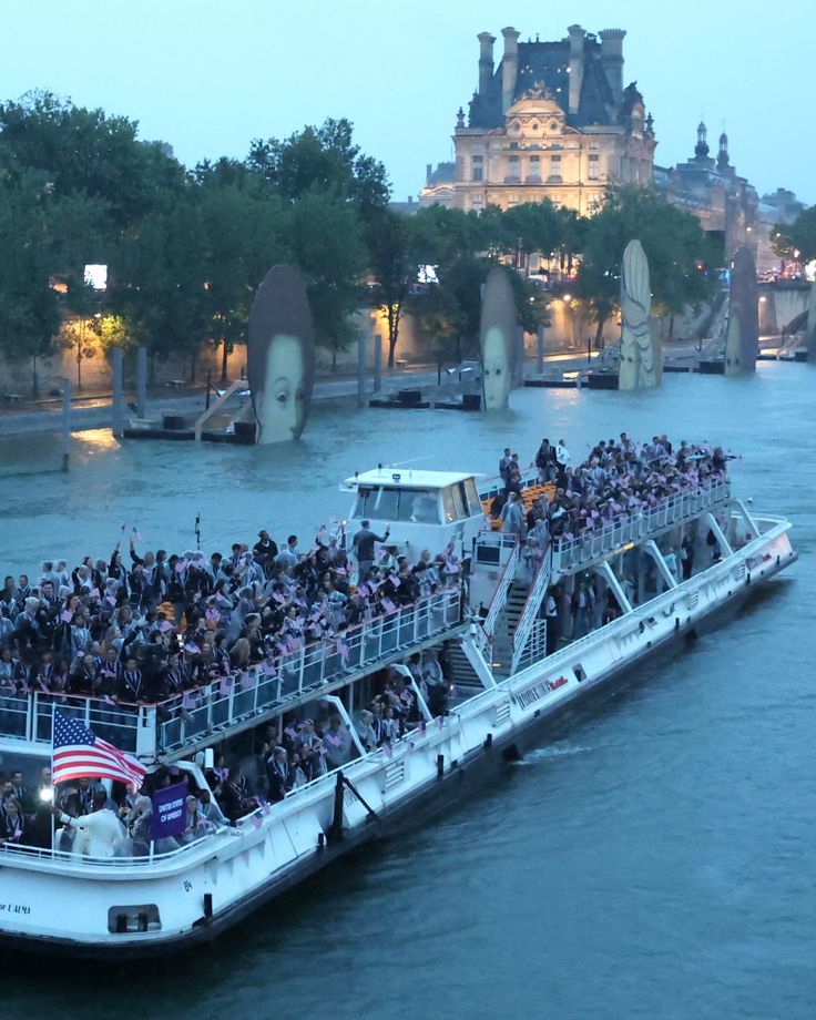 a large boat filled with people on the water