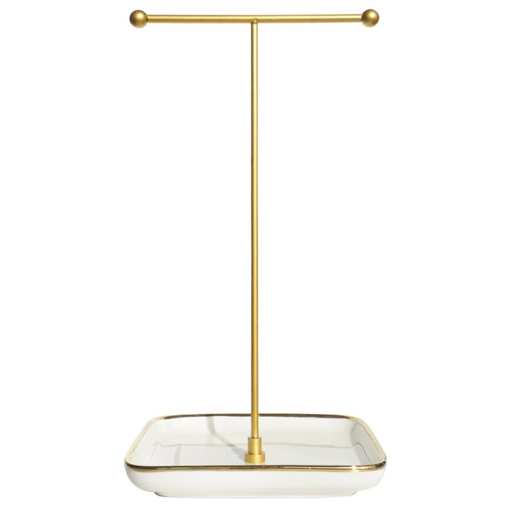 a brass and glass candle holder on a white background