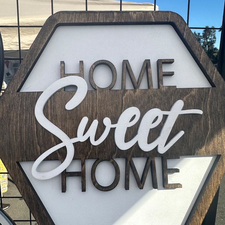 a wooden sign that says home sweet home