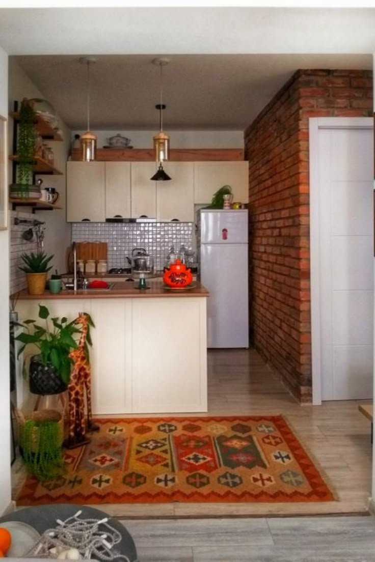 the kitchen is clean and ready to be used as a living room or dining area