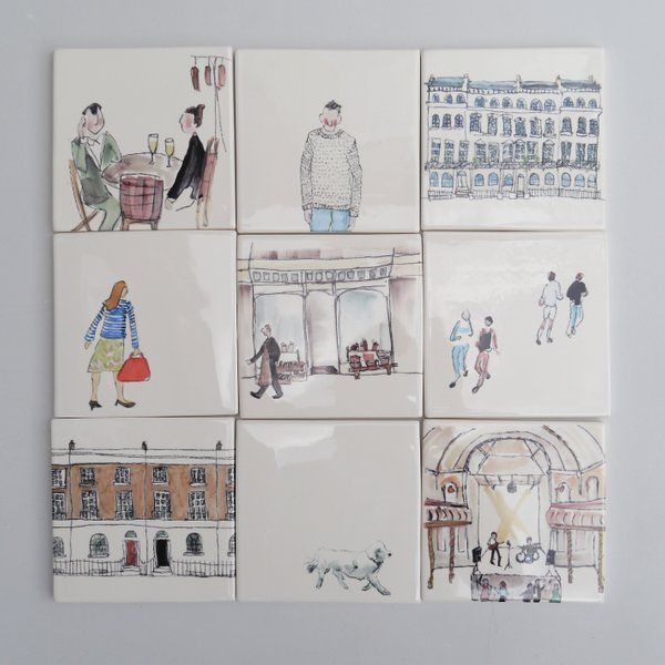 four ceramic tiles depicting people walking and shopping in different cities, each with an individual's drawing on them