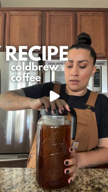 a woman pouring coffee into a mason jar