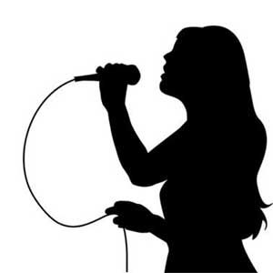 the silhouette of a woman singing into a microphone