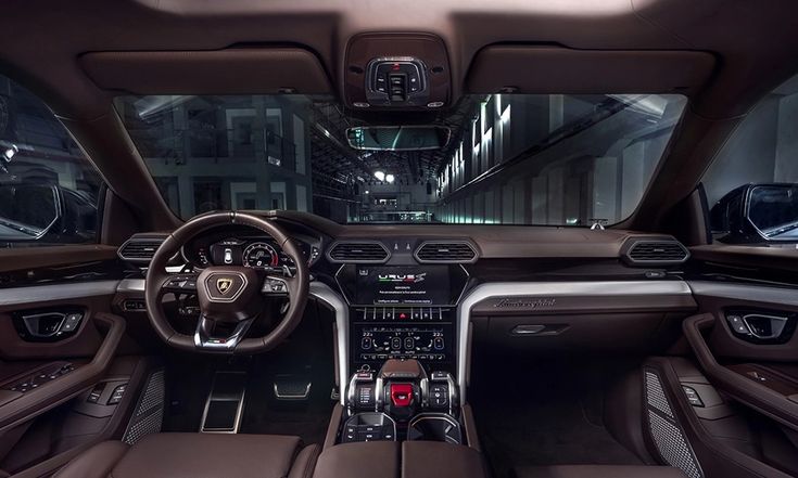 the interior of a car with brown leather seats and steering wheel, dash lights, and dashboard controls