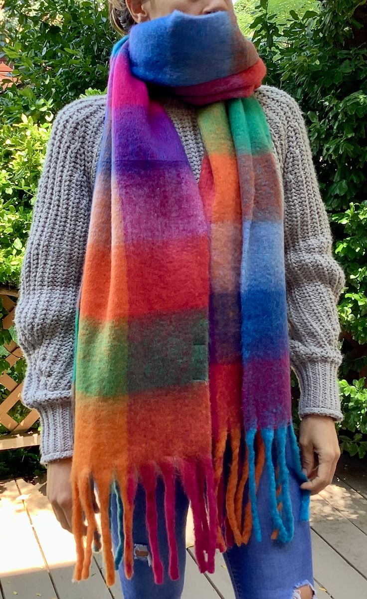 ❤ Our most popular scarf, this vibrant, colourful and cozy scarf is extra warm for those soon to be cold winter days. Wrap it, drape it, snuggle under it. All scarves are 100% Polyester and are washable, durable and animal free.  Ends are finished with hand twisted tassels for that unique look. ❤ These trendy blanket scarves are a great way to accessorize your wardrobe.  Wear it throughout the season to add a splash of colour  to your outfit!  ❤ Each scarf is rolled with twine and is ready for g Colourful Scarf Outfit, How To Wear A Blanket Scarf, Trendy Blanket, Blanket Scarves, Loving Mother, Mohair Scarf, Womens Scarf, Rainbow Scarf, Scarf Outfit