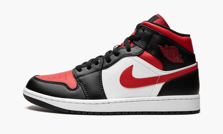 The Air Jordan 1 Mid “Bred Toe” is a colorway of the lifestyle shoe that features the white, black, and red team uniform colors of the Chicago Bulls on its design.  Inspired by the original Air Jordan 1 High “Black Toe” colorway that Michael Jordan wore with the Bulls in 1985, the modern day “Bred Toe” version of the Jordan 1 Mid updates the classic style, and it does so with ease.  Red leather appears on the perforated toe while contrasting black leather can be found on the toe cap, forefoot, e Zapatillas Nike Air Force, Logo Wings, Red Wing Logo, Air Jordan 1 Mid White, Air Jordan 1 Mid Black, Jordan 1 Mid White, Air Jordan 1 Mid Gs, Black Tongue, Original Air Jordans