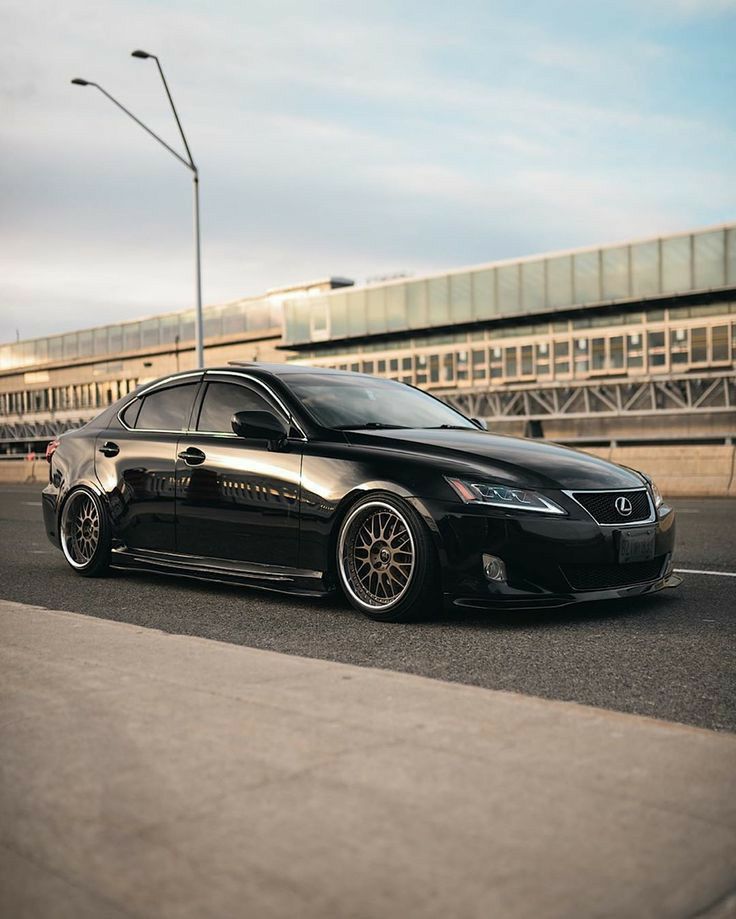 a black car is parked on the street