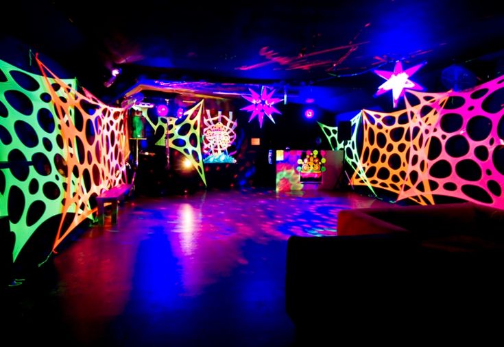 brightly lit room with colorful lights and decorations