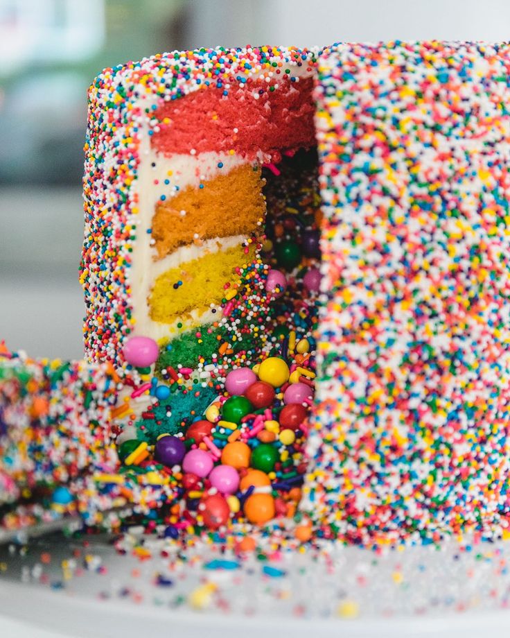 a cake with sprinkles on it is cut in half