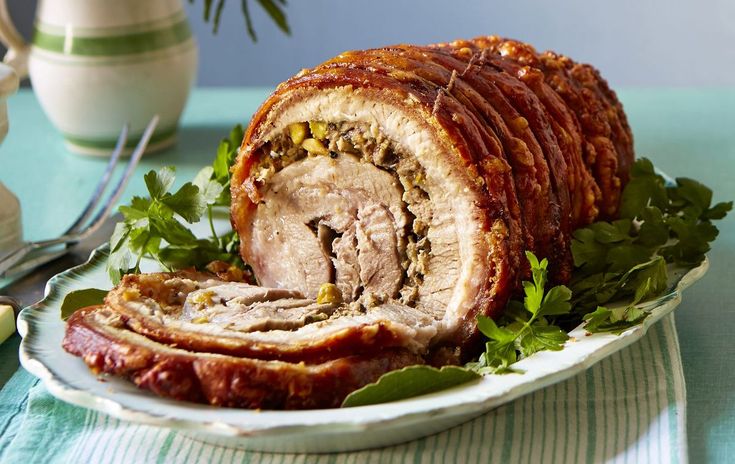 a sliced meatloaf on a plate with parsley