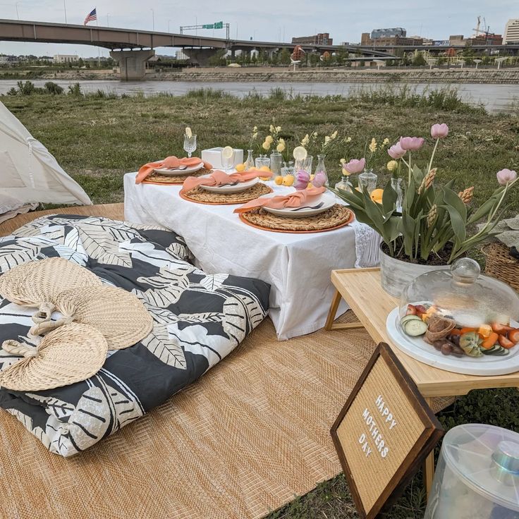 a picnic table with food and drinks on it