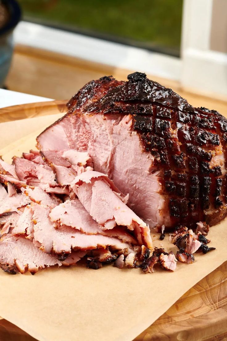 a large piece of meat sitting on top of a cutting board