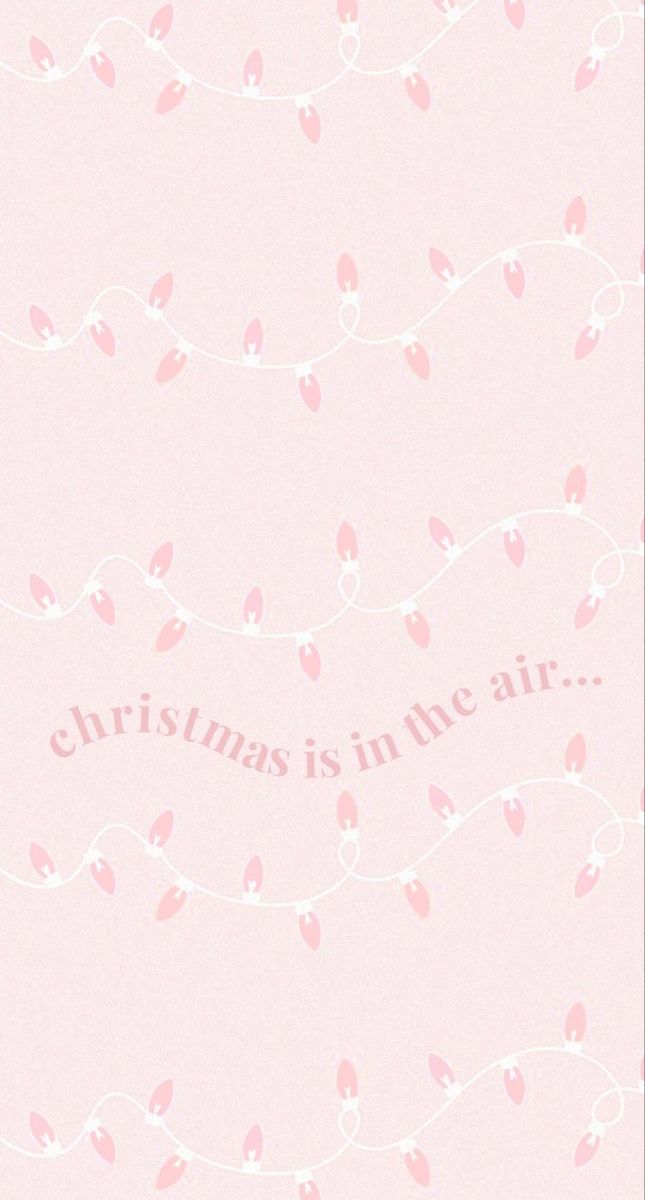 a pink wallpaper with hearts and the words christmas is in the air on it