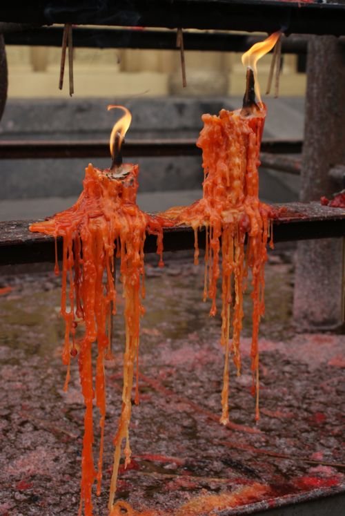 two candles that have been burnt and melted