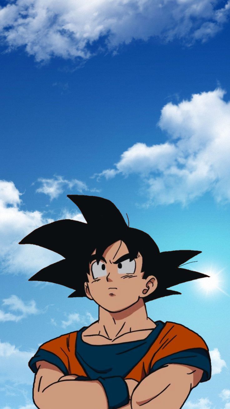 the young gohan is standing with his arms crossed in front of a blue sky