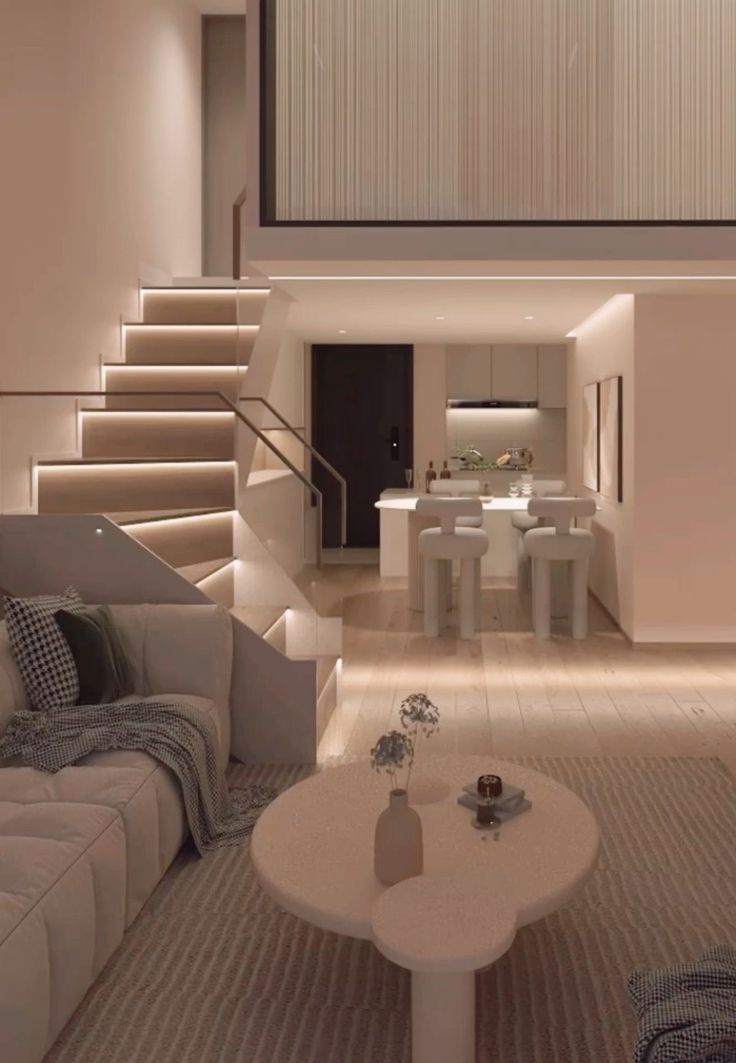 a living room filled with furniture and a staircase