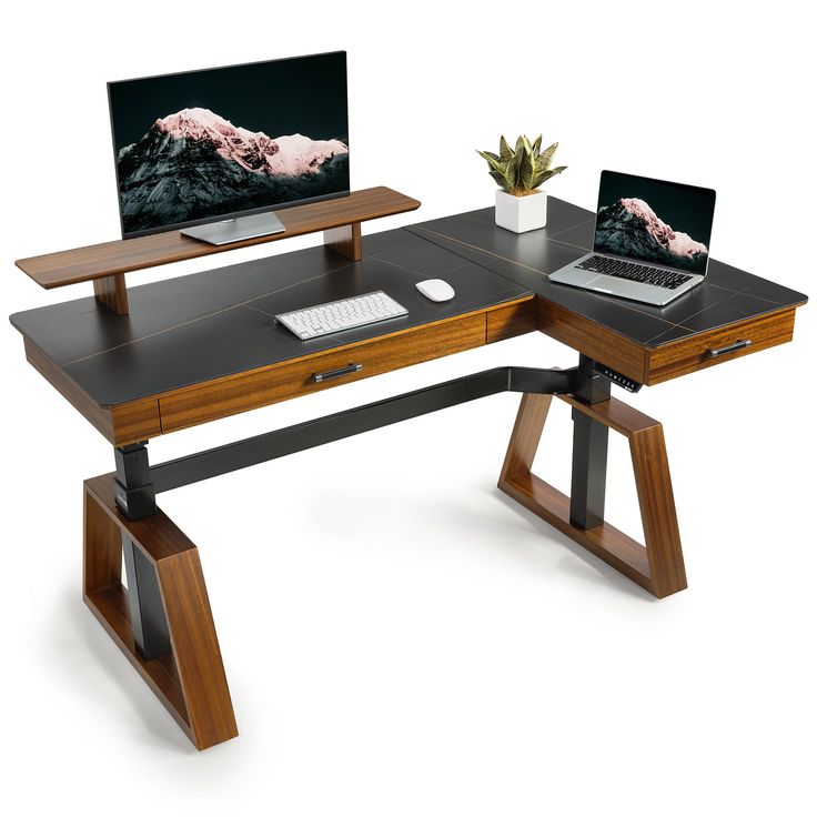 a computer desk with two laptops on it