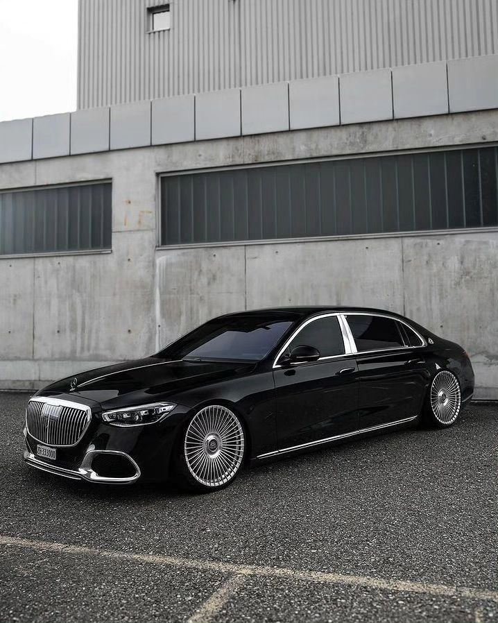 a black car parked in front of a building