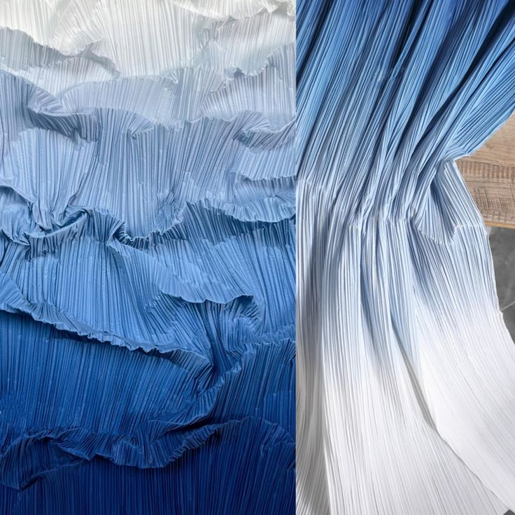 two different shades of blue and white pleated fabric, one in the process of being dyed