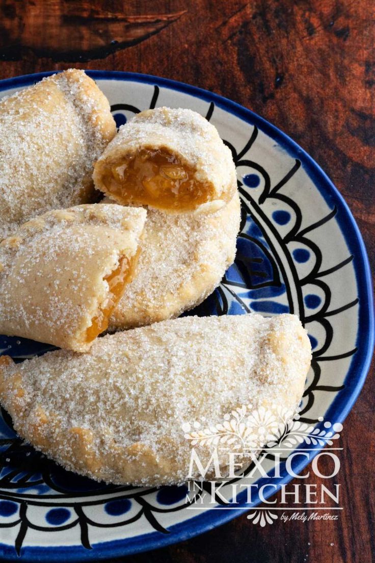 three pastries on a blue and white plate