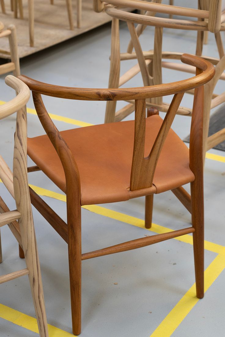 several wooden chairs are lined up on the floor