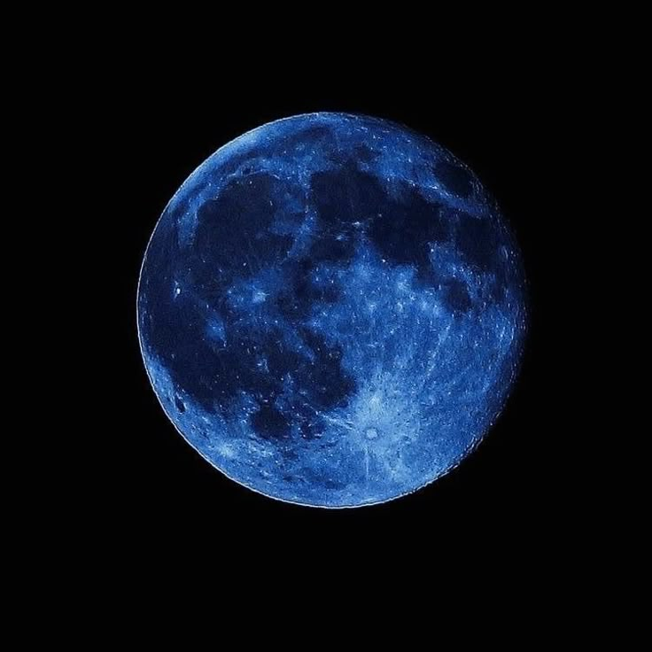 the blue moon is seen in the dark sky