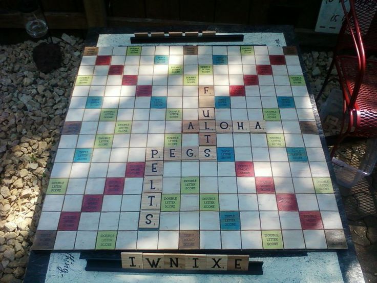 a scrabble board with words written on it