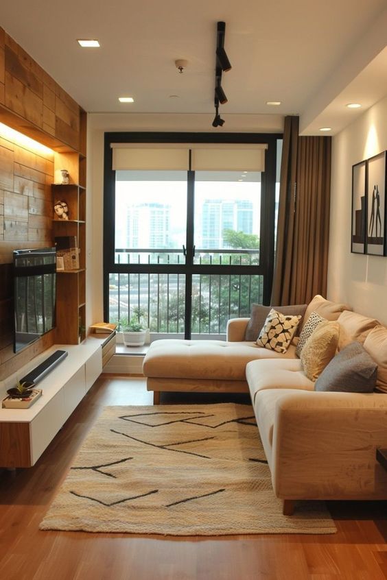 a living room filled with furniture and a flat screen tv mounted on a wall next to a fire place