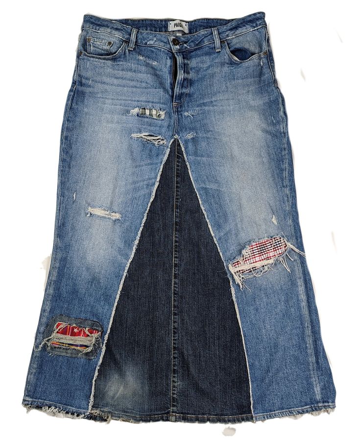 a skirt made out of jeans with patches on the side and zippers at the bottom