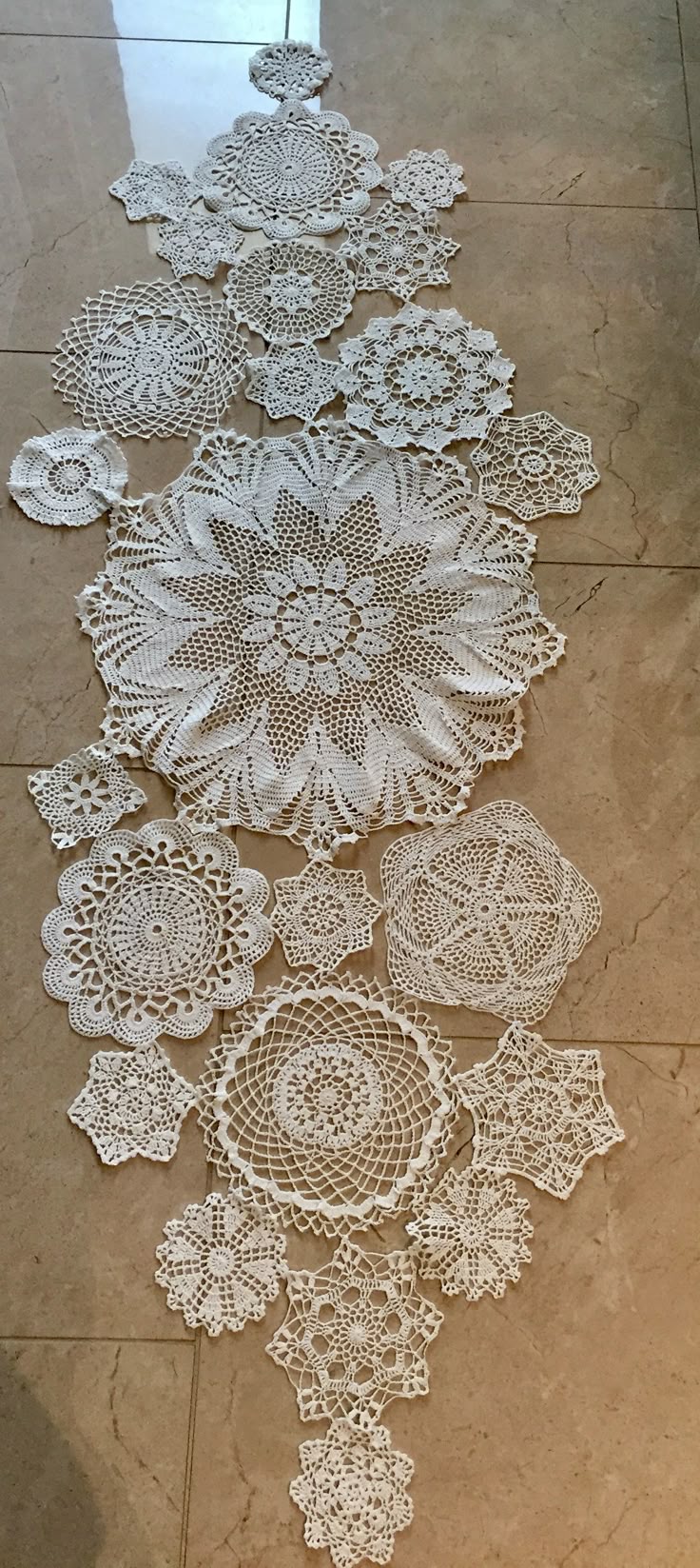 there are many crocheted doily on the floor