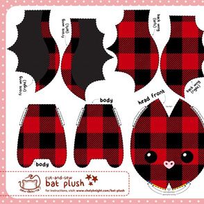 the paper doll is designed to look like it has red and black checkered fabric