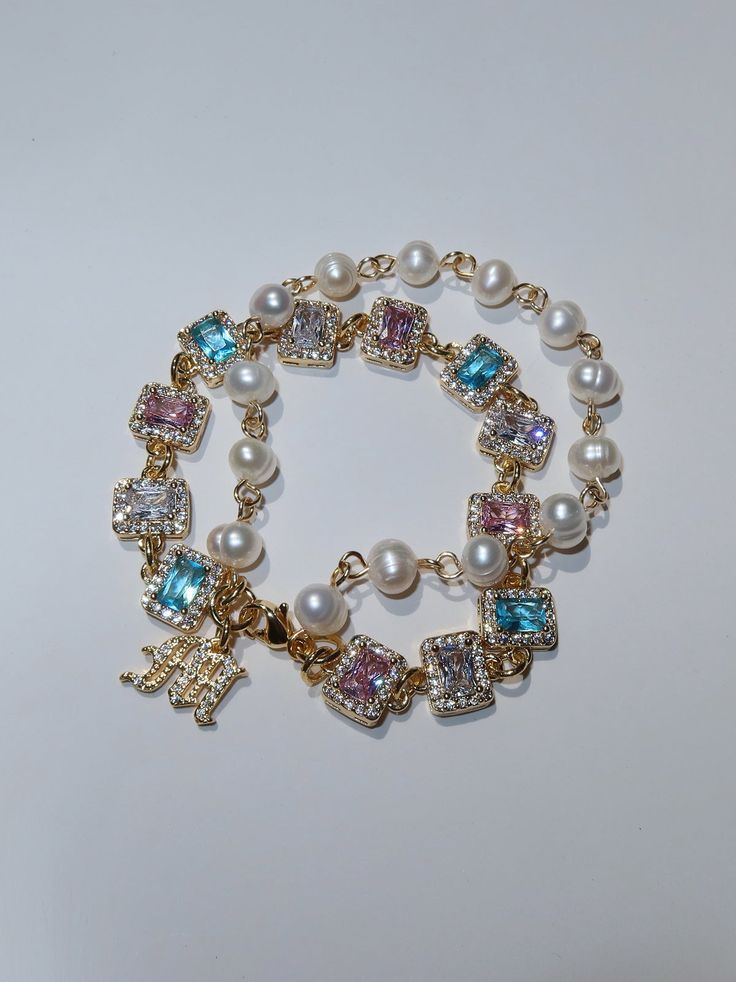 Handmade in Los Angeles with meticulous attention to detail, this luxurious accessory will easily become a cherished piece in your jewelry collection. From stunning baby blue, pink, and white CZ encrusted gemstones to freshwater pearls, the '549' bracelet is the perfect piece to complete all your looks!  Made with AAA- Gold Letter Pendants, Xoxo Jewelry, Girly Bracelets, Dope Jewelry Accessories, Body Jewelry Piercing, Jewelry Accessories Ideas, Gold Letter, Dope Jewelry, Creating Jewelry