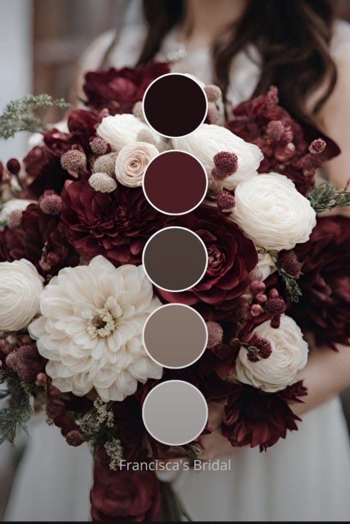 a bridal bouquet with burgundy and white flowers, greenery, and foliage is the focal point for this wedding color scheme