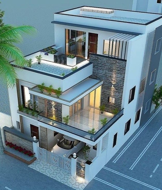 an aerial view of a two story house with balconies and palm trees in the foreground