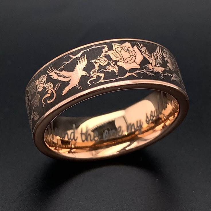 Add something unique and elegant to your jewelry collection. This wedding ring is crafted from rose gold plated tungsten carbbide with deluxe rounded comfort fit interior. The ring features a beautiful design with ravens & roses. Raven is a spirit bird. When you need spiritual rebirth, listen to her warnings respectfully. She is there to protect and guide. The ring is true to size and having your finger size properly measured before ordering is must. It is heavy enough to be felt and pretty enou Unique Luxury Engraved Ring For Ceremonial Occasions, Ornate Luxury Engraved Ring For Ceremonies, Luxury Classic Engraved Ring For Ceremonial Use, Engagement Rings For Men For Him Rose Gold, Mens Fairy Wedding Ring, Luxury Black Heirloom Engraved Ring, Luxury Handmade Mystical Rings, Supernatural Wedding Rings, Luxury Mystical Collectible Rings