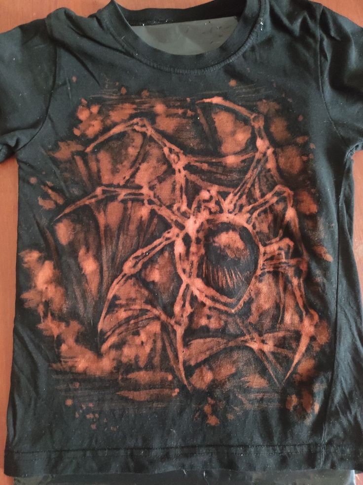 a t - shirt with an image of a spider on it