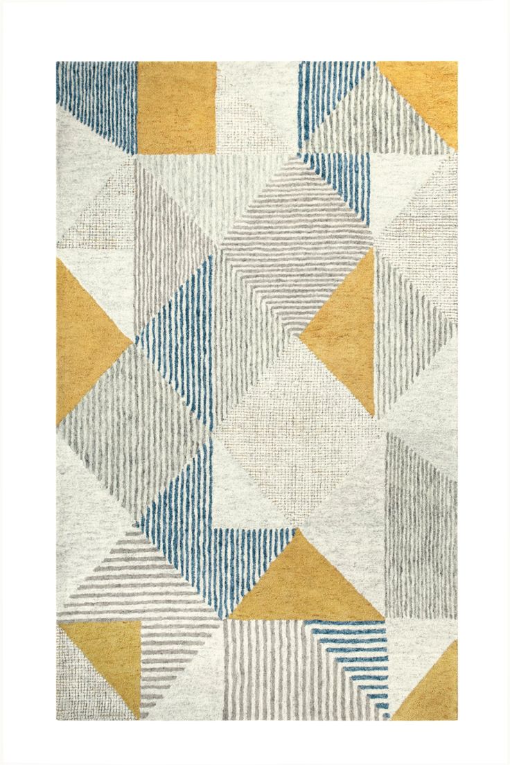 an area rug with different colors and shapes on the ground, including yellow, blue, grey