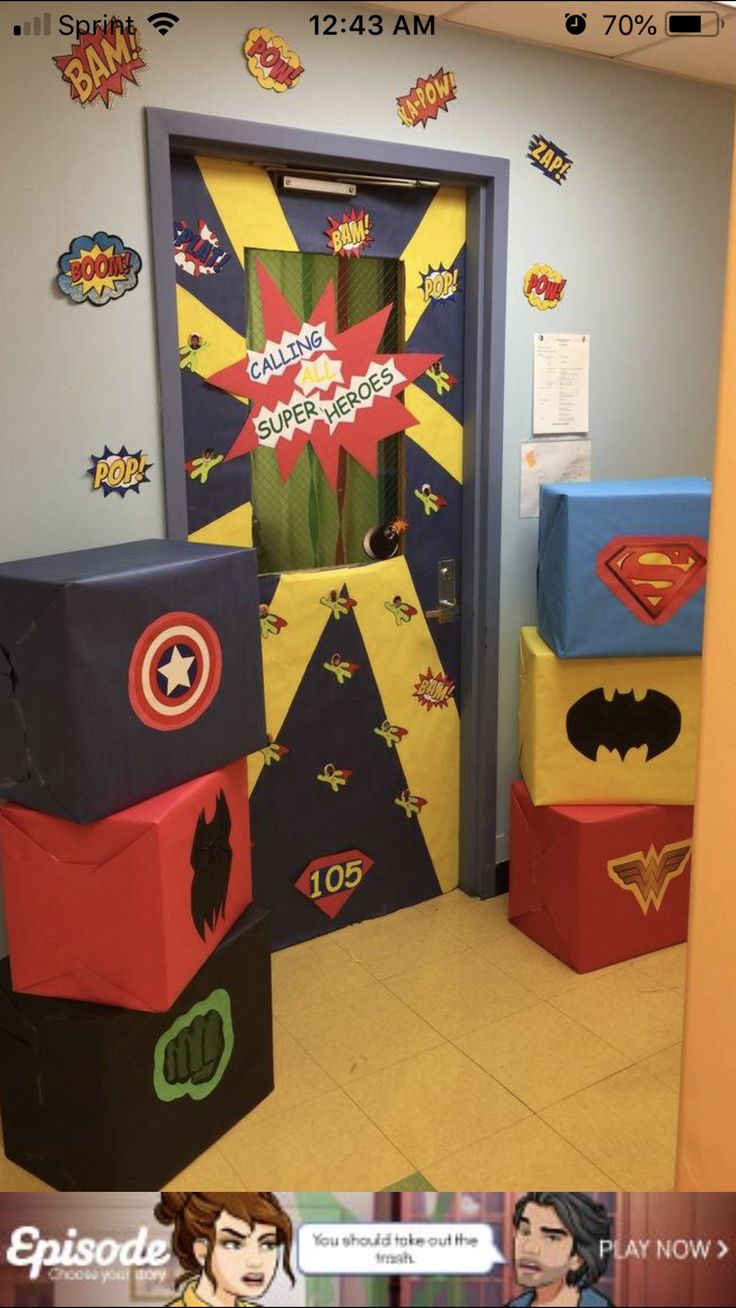 the door to an office decorated with superheros and captain america themed boxes on display