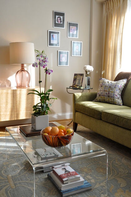 a living room filled with furniture and a glass coffee table