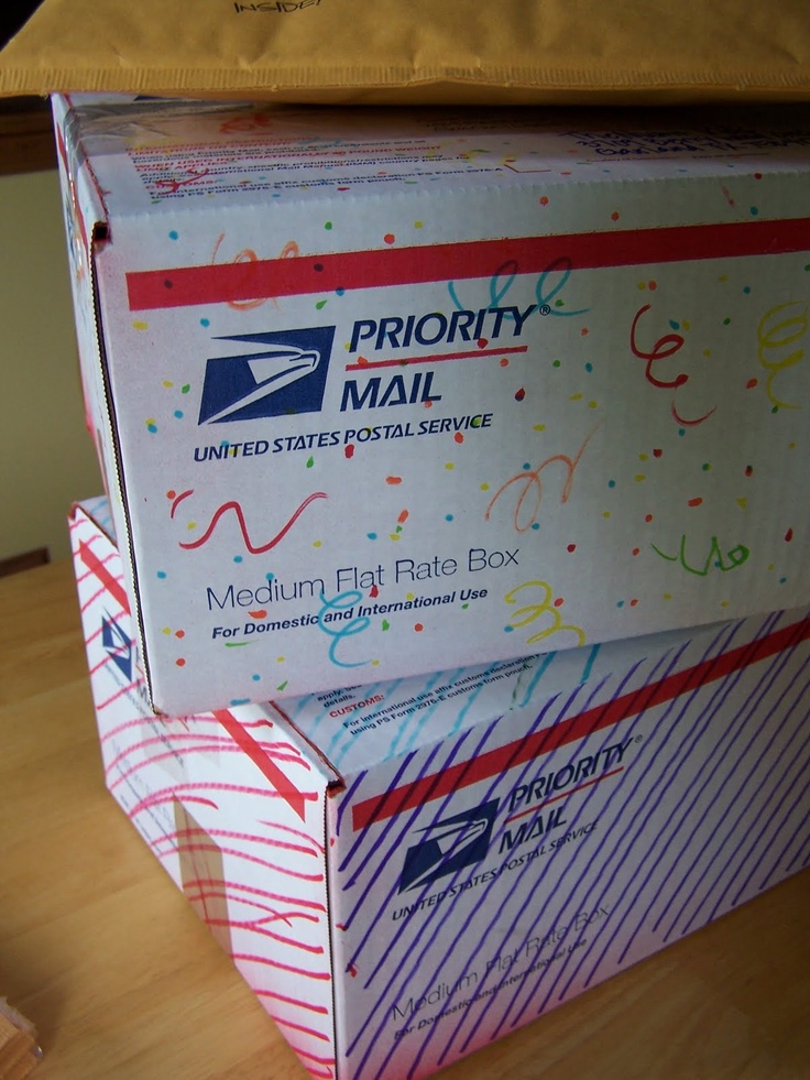 two mail boxes stacked on top of each other in front of a box that says priority mail