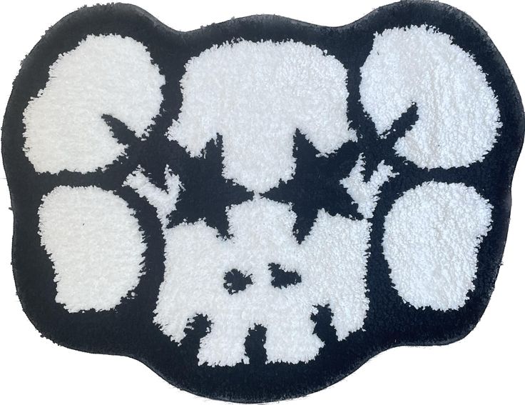 a black and white rug with different designs on the front, side and back of it