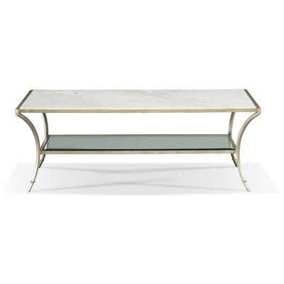 a white marble and metal coffee table with shelves on one side, in the shape of a rectangle