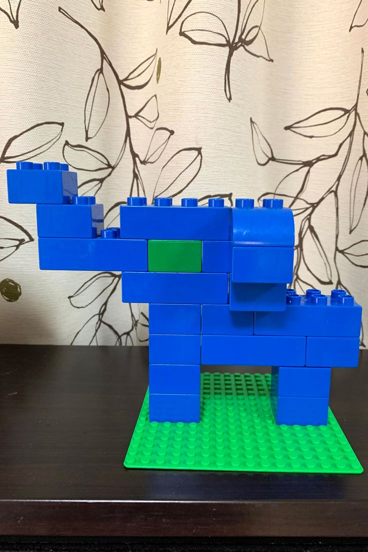 a lego model of a blue elephant on a table