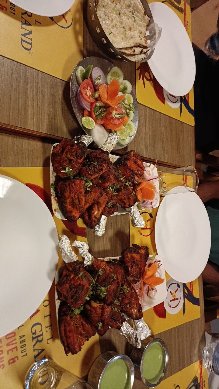 a table topped with plates and bowls filled with different types of food on top of it