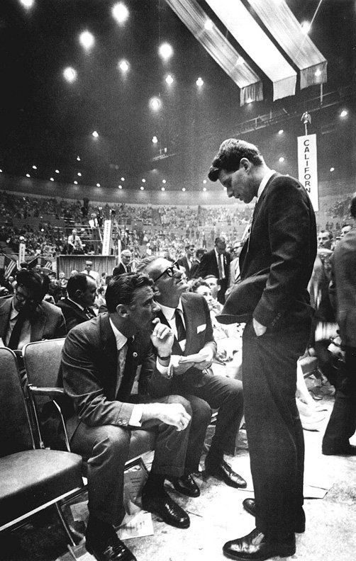 a man standing in front of an audience at a convention