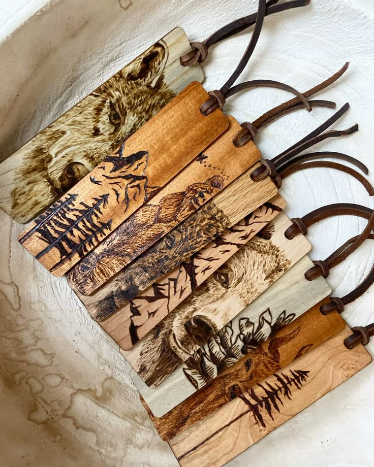 four wooden tags with animals on them