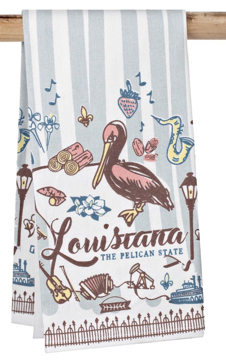 a towel hanging on a clothes line with the words, louisiana and pelican state