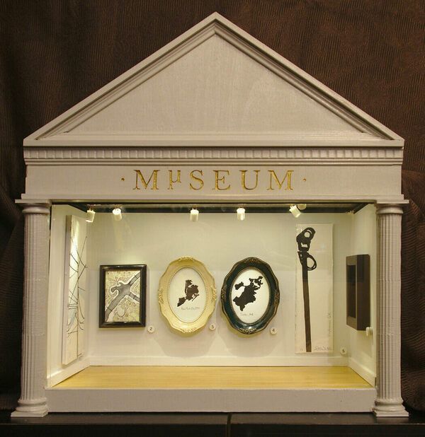 a museum display case with various items on it's sides and the words museum in gold lettering