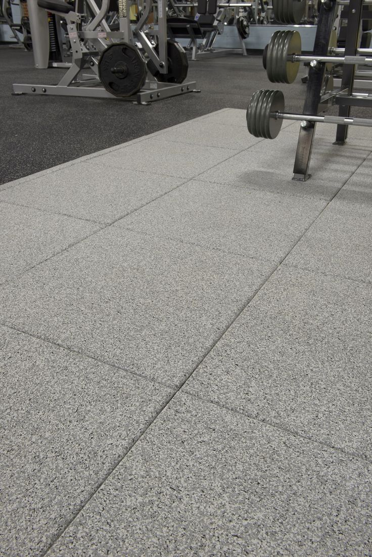 the gym floor is clean and ready for someone to use it as an exercise area